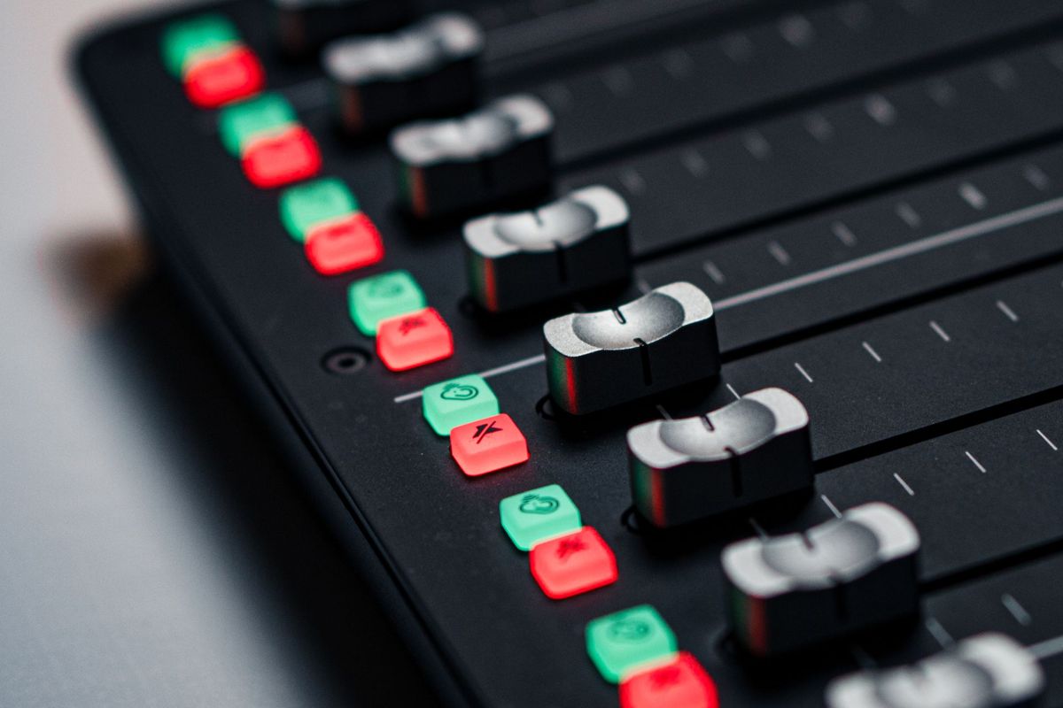 Music mixing console faders, for a post on AI streaming fraud and federal wire fraud